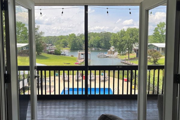Love this view of the pool and the lake from the family room.