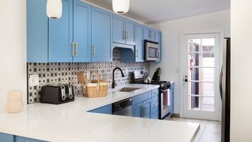 Microwave, coffee/tea maker, toaster, cookware/dishes/utensils