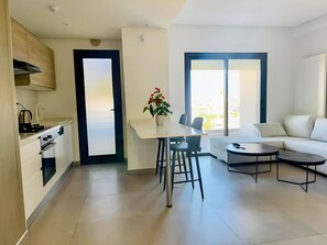Enjoy a stylish living space with a kitchen, dining area, and cozy seating area.