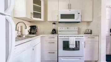 Coffee/tea maker, fridge, microwave, oven