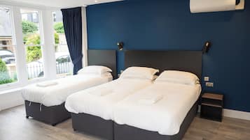 Family Triple Room | Egyptian cotton sheets, premium bedding, in-room safe, desk