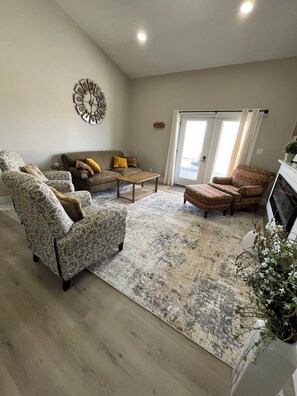 Smart TV, fireplace, books, printers