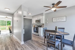 Enjoy meals in the kitchen with a microwave and oven, and dine at the round table with four chairs.