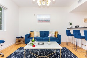 Deluxe Apartment | Living area | 32-inch Smart TV with digital channels