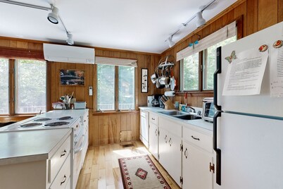 Charming Lakefront Retreat with Canoes, Kayaks, and Modern Comforts