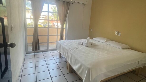 Family Room | Free WiFi, bed sheets - Hotel and Bungalows Palaces (San Patricio Melaque)