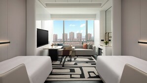 A modern hotel room with a city view, a flat-screen TV, a desk with a chair, and two beds. - Crowne Plaza Suzhou East Taihu by IHG (Suzhou)
