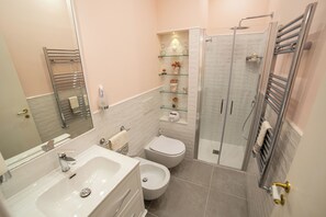 Hair dryer, bidet, towels, soap
