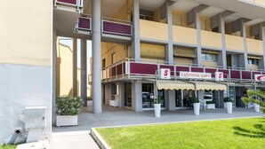 A multi-story building with a ground-level cafe named 'Caffetteria Gabri' and a visible outdoor seating area. -  SE085 - new two-room apartment facing the sea at the ''Pyramids'' (Senigallia)
