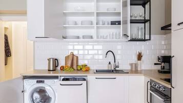 Fridge, stovetop, dishwasher, coffee/tea maker
