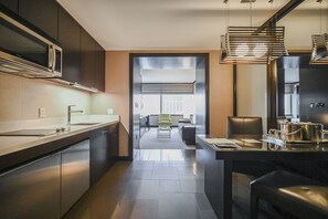 Fridge, microwave, stovetop, coffee/tea maker