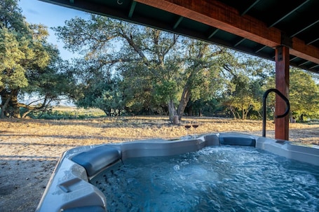Outdoor spa tub. Country Cowboy Hot Tub Home on 20 Acres
