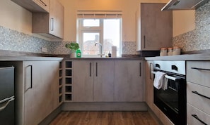 Coffee/tea maker, fridge, microwave, oven