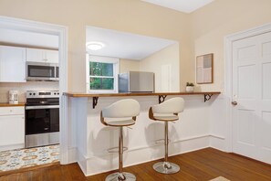Fridge, microwave, oven, stovetop - Executive Rental by the Park | Heated Pool Access (Savannah)