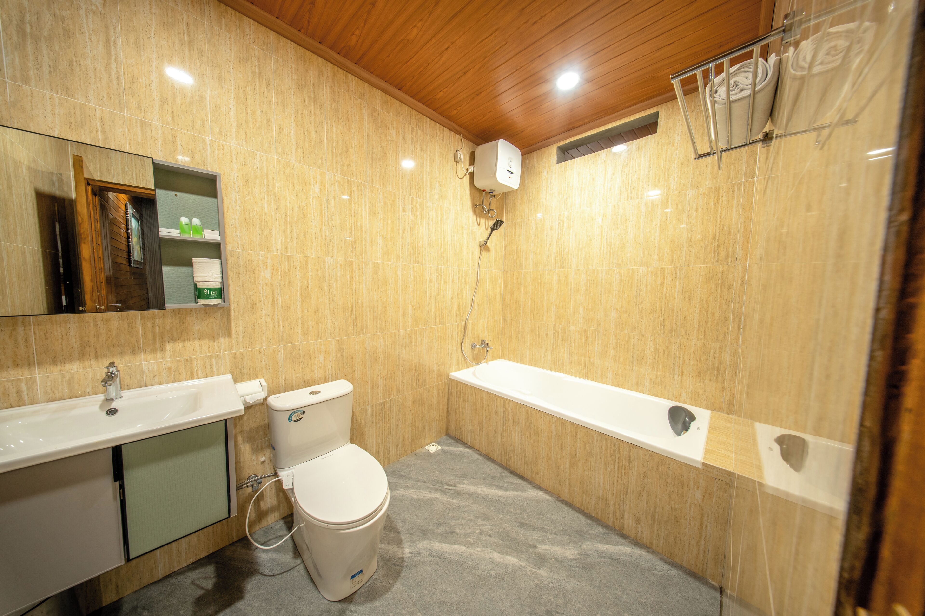 A bathroom with a toilet, sink, and bathtub.