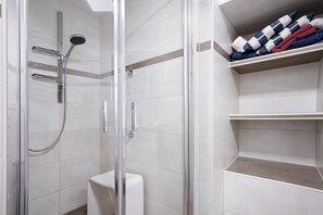 Shower, hair dryer, towels
