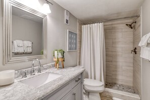 Shower, hair dryer, towels, shampoo