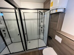 Shower, hair dryer, towels, shampoo