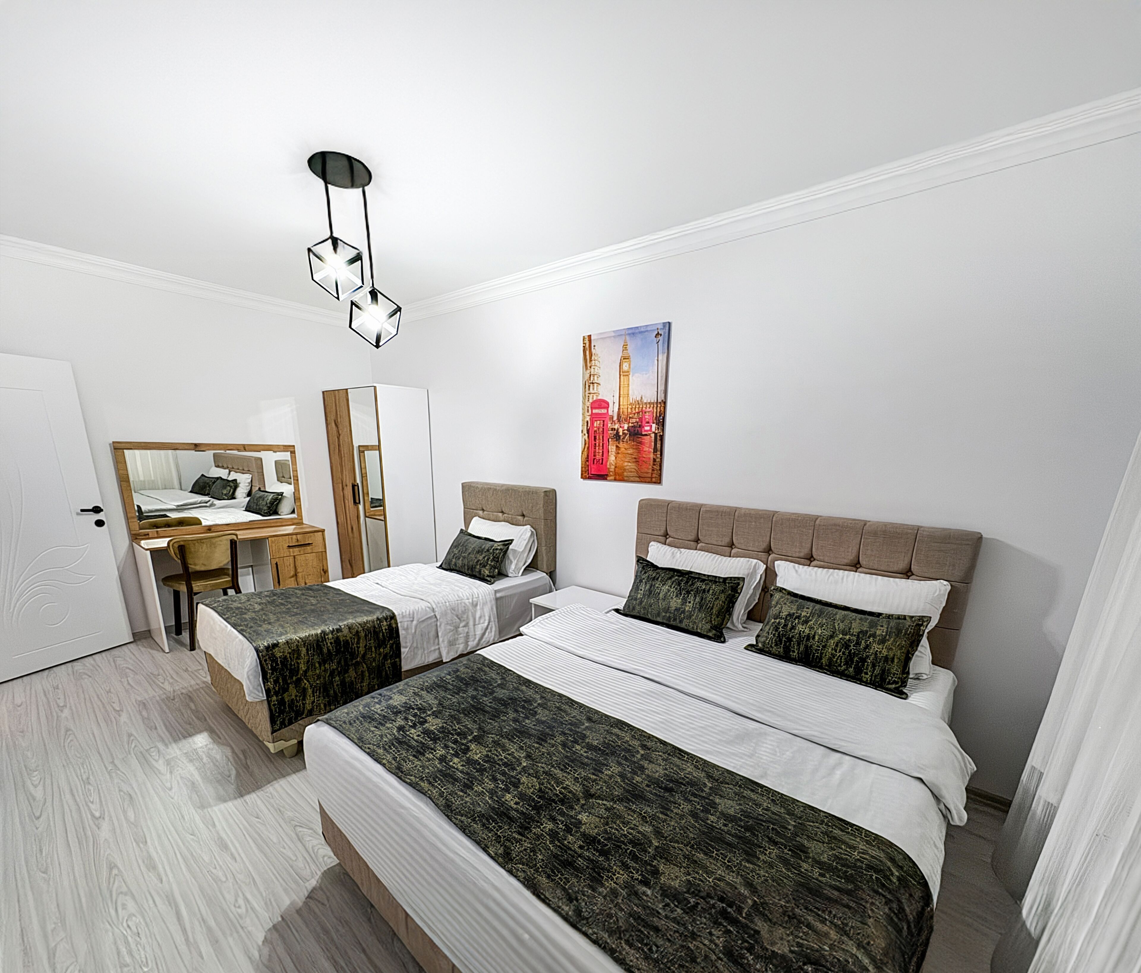 Premium bedding, desk, laptop workspace, soundproofing