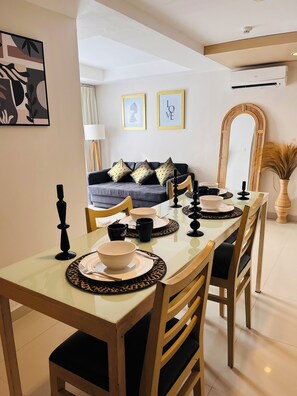 Exclusive Apartment, Balcony, City View | Living area | 50-inch Smart TV with digital channels - Casa Kuta View 2 BR (Kuta)