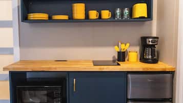 Microwave, stovetop, coffee/tea maker, cookware/dishes/utensils