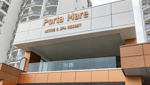 A modern building with a sign reading "Porta Mare Active & Spa Resort".