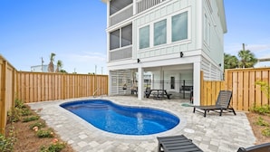 A two-story house with a swimming pool, wooden deck, and outdoor furniture. - Twist of Lime - Mexico Beach, Unobstructed Gulf view, Elevator, Private Pool, Tw (Mexico Beach)