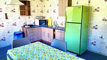 Family Cottage, Garden View | Private kitchen | Full-size fridge, microwave, stovetop, dishwasher