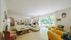 A spacious living room with a dining area, a yellow sofa, and a white sofa. - Pet friendly home in Aix-En-Provence (Aix-En-Provence)