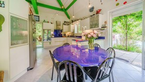 A modern kitchen with a central island, white cabinets, and a green ceiling. - Pet friendly home in Aix-En-Provence (Aix-En-Provence)