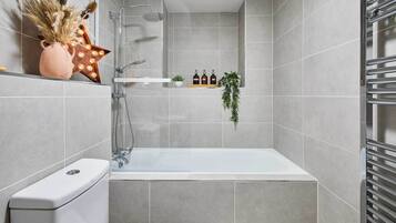 Shower, hair dryer, towels, shampoo