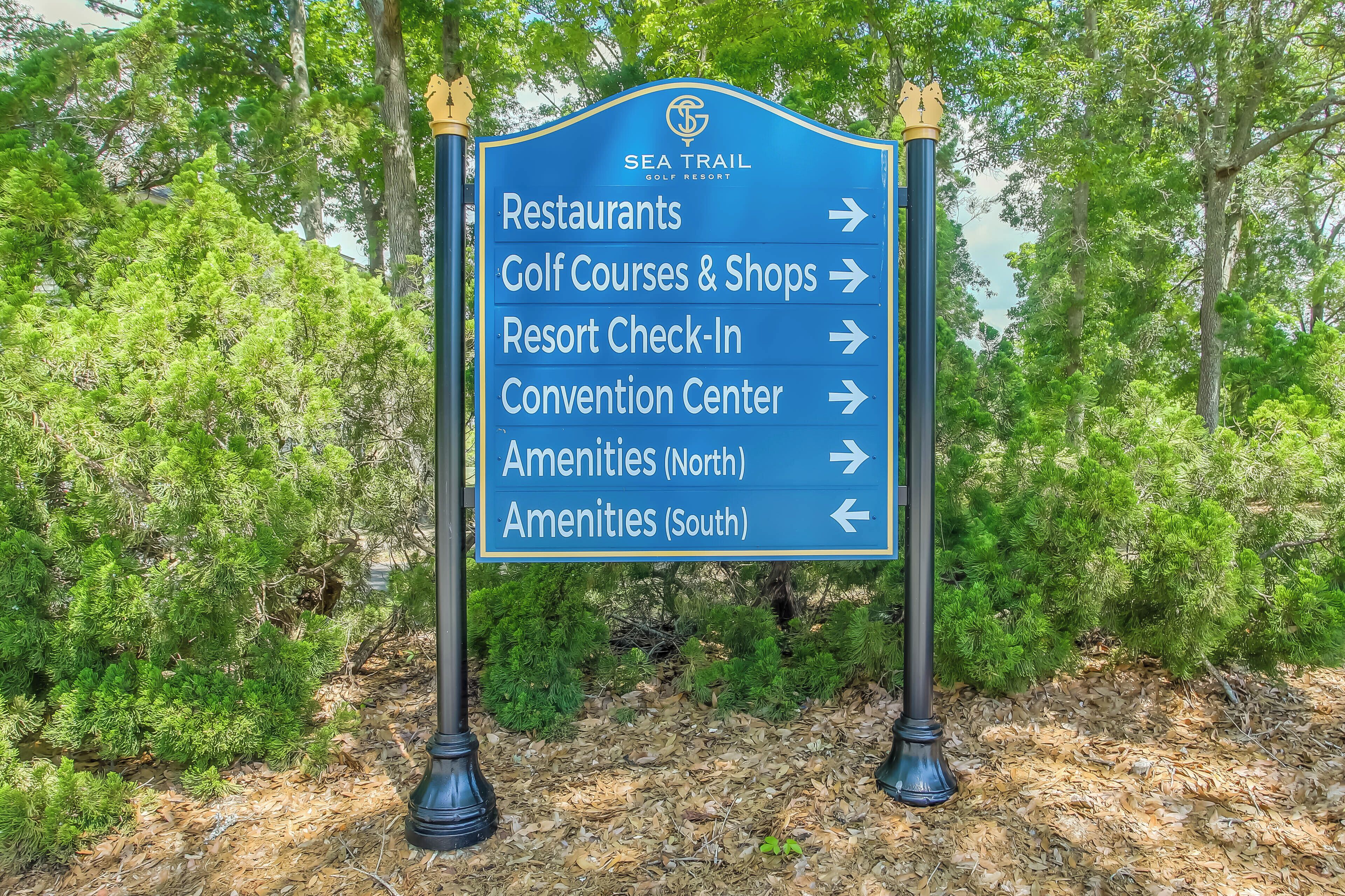 A directional sign at Sea Trail Golf Resort indicating amenities and facilities.