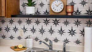 A kitchen with a double sink, a clock, a potted plant, and a book titled "D.I.E.T. Did I Eat That?". - 5 Minutes to VSU, I-75 & Restaurants! Sleeps 5 w/ 2 Full Baths- Family Friendly (Remerton)