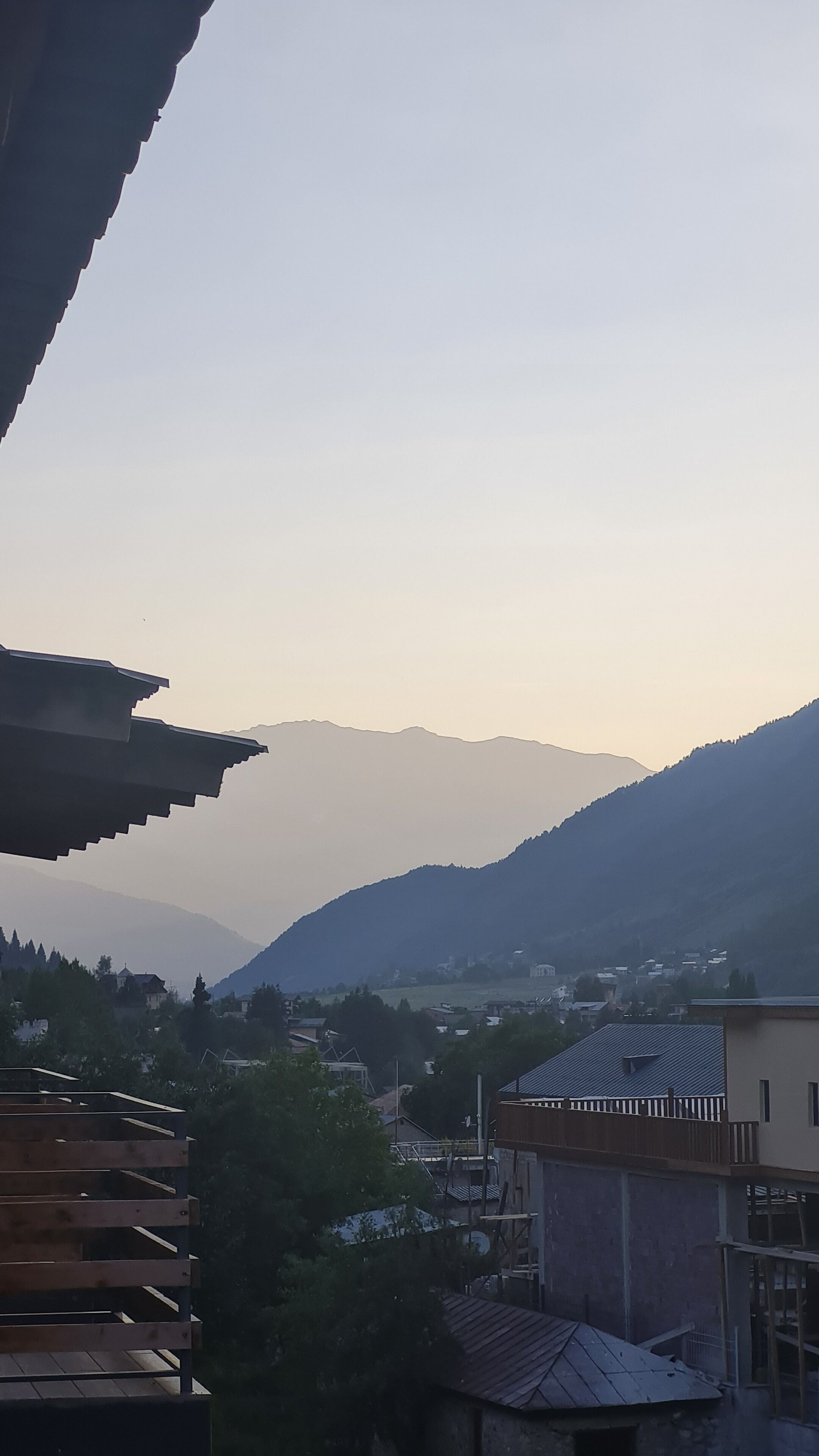 A mountainous landscape with a town in the valley.