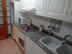 Fridge, microwave, oven, cookware/dishes/utensils