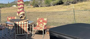 One room guest house with hot tub, three twin beds, one futon, kitchen, bathroom