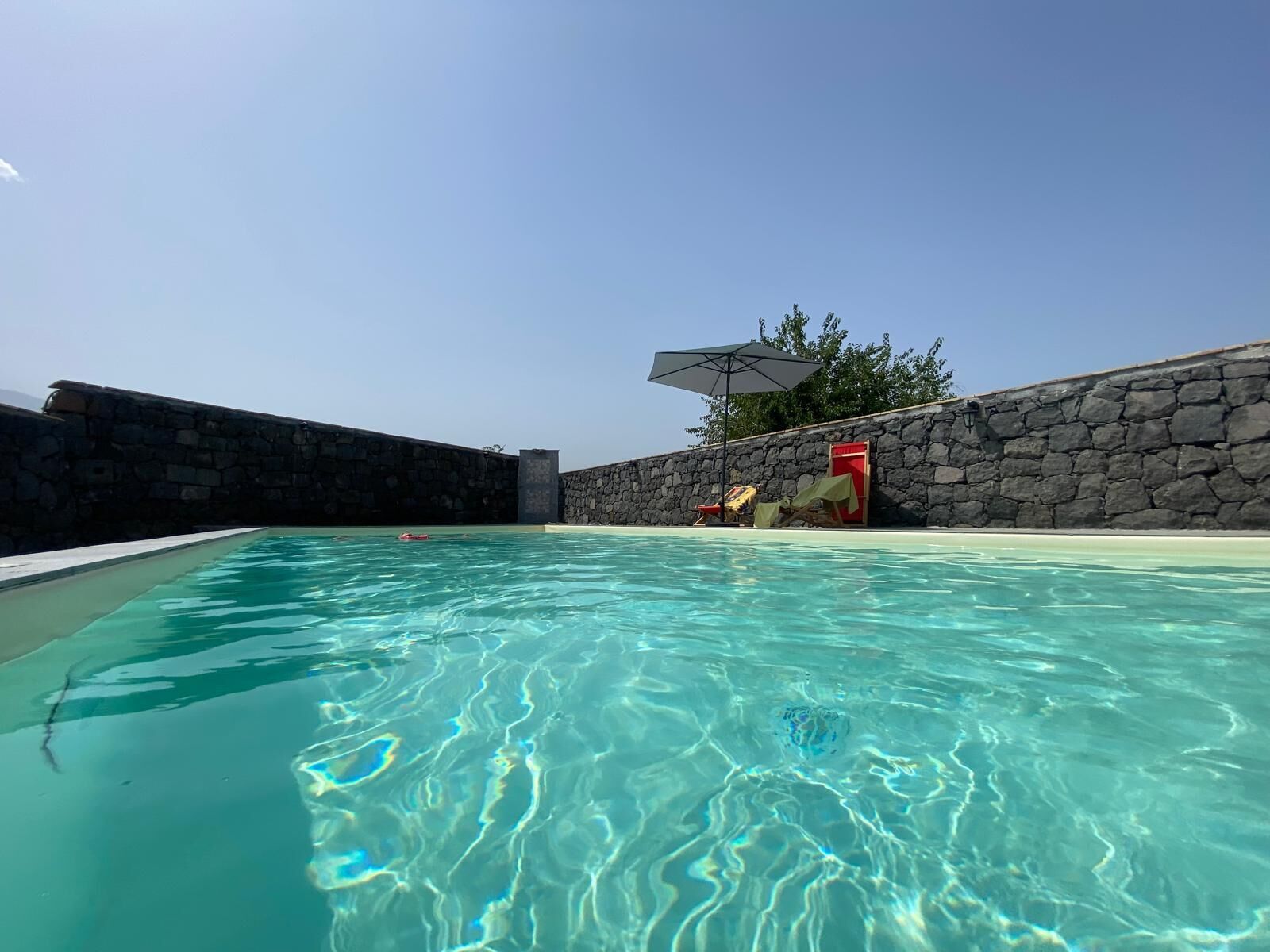 Outdoor pool, open 11:00 AM to 7:00 PM, pool umbrellas, sun loungers