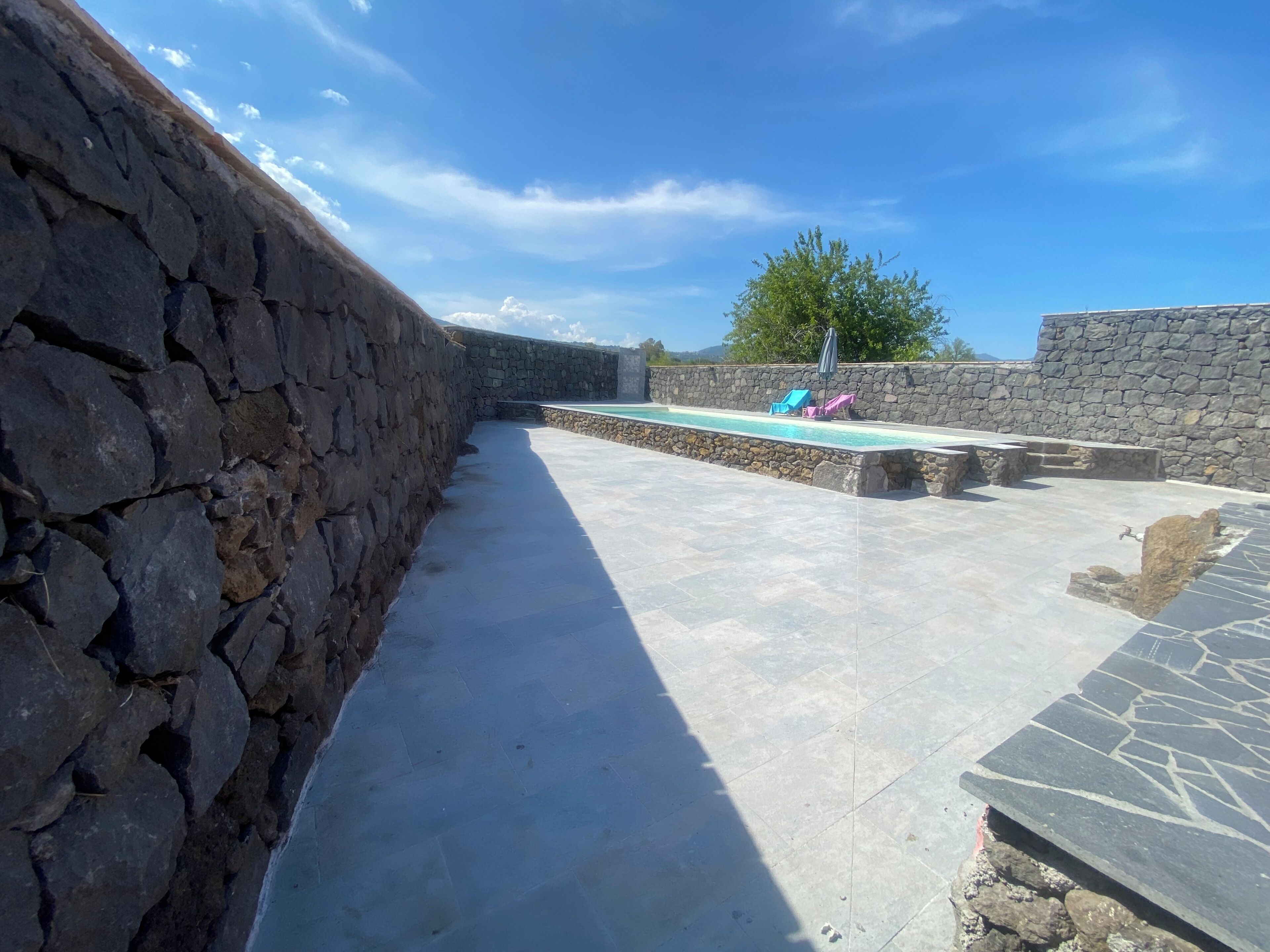 Outdoor pool, open 11:00 AM to 7:00 PM, pool umbrellas, pool loungers