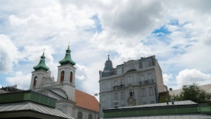 A historic building with two green-roofed towers and a large central dome. - Vienna Residence, Rochusmarkt - Wien Mitte #6427 (Vienna)