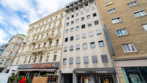 A multi-story building with a mix of architectural styles, including a classical facade and a modern section with large windows. - Vienna Residence, Rochusmarkt - Wien Mitte #6427 (Vienna)