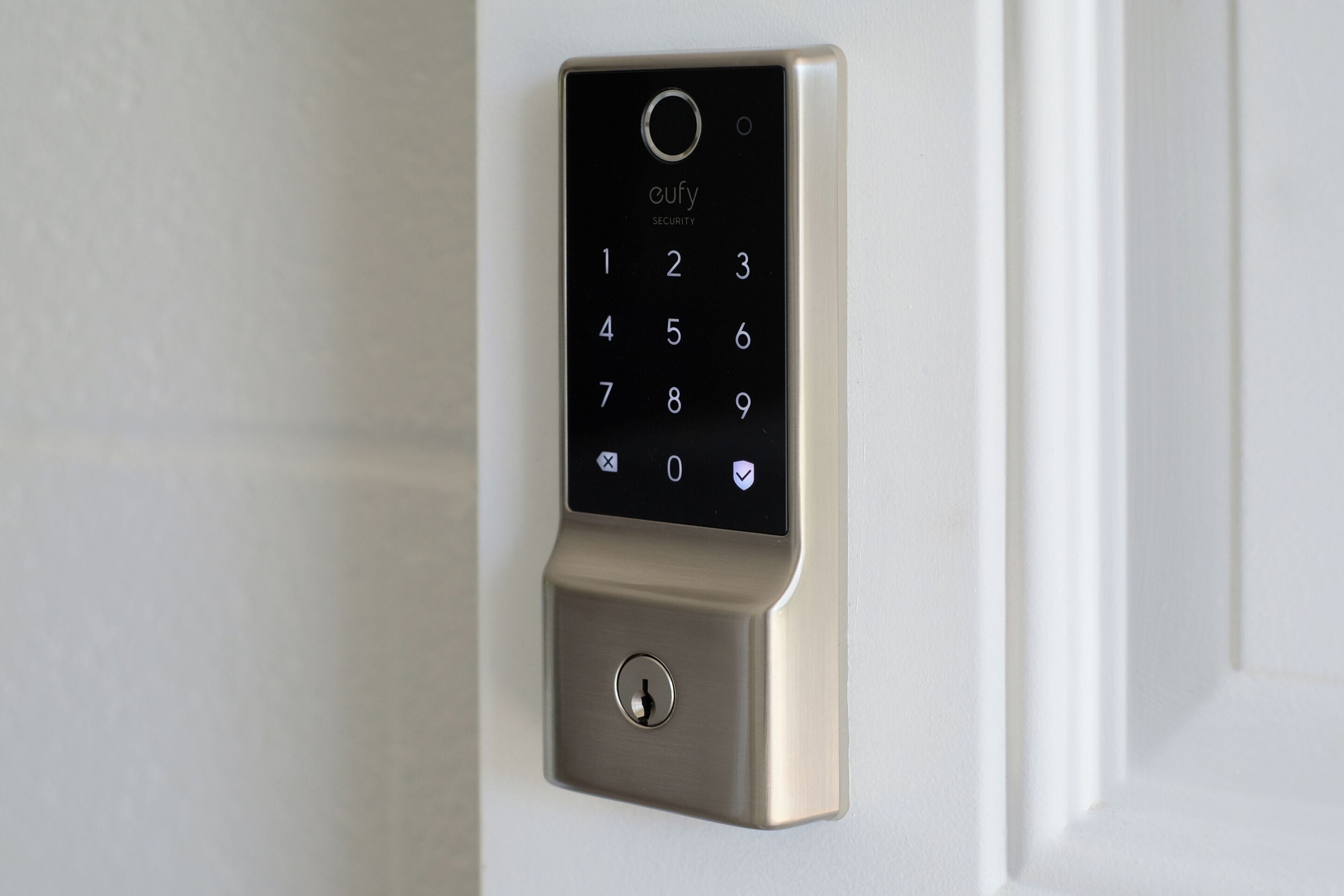 A wall-mounted electronic keypad lock.