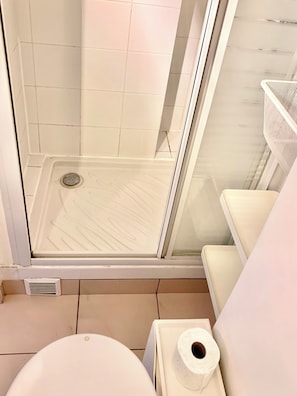 Shower, towels, soap, toilet paper