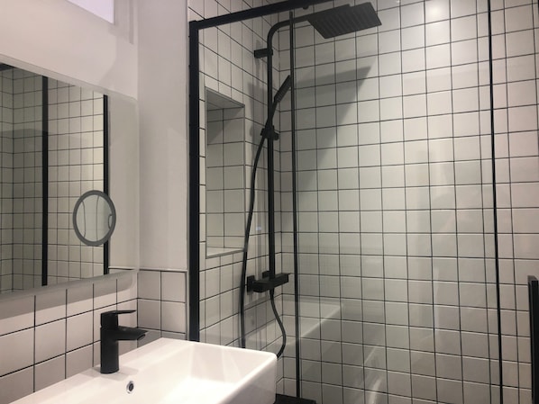 Shower, hair dryer, towels, soap