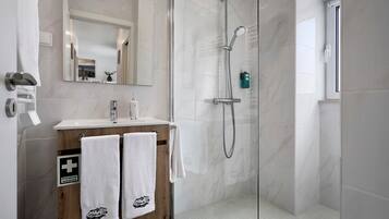 Shower, hair dryer, towels