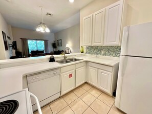 Condo, Multiple Beds, Pool Access, Garden View (Charming Villa at Bahama Bay) | Private kitchen | Coffee/tea maker