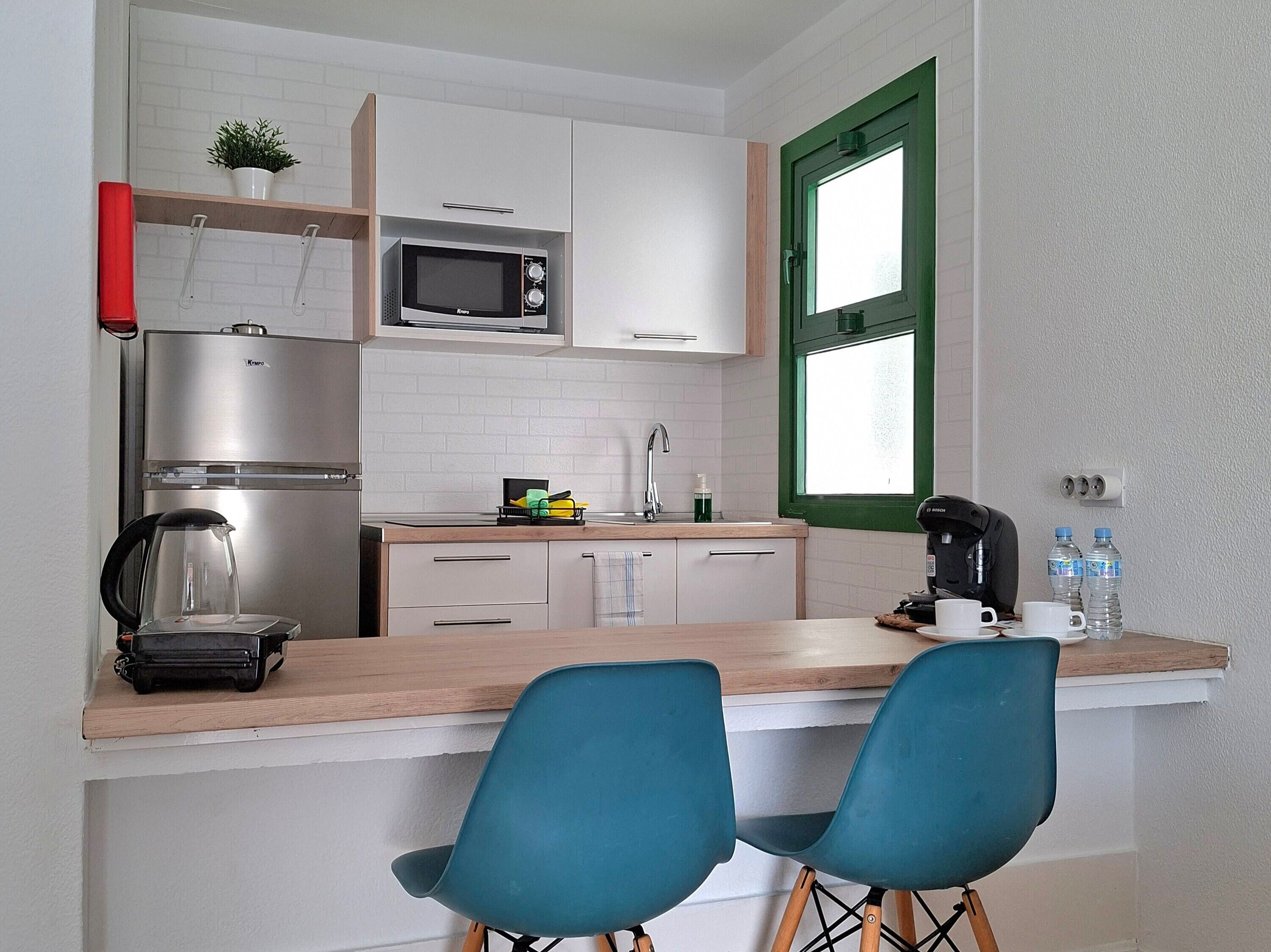 Fridge, microwave, stovetop, coffee/tea maker