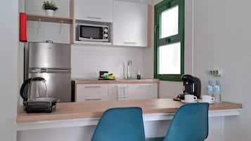 Fridge, microwave, stovetop, coffee/tea maker