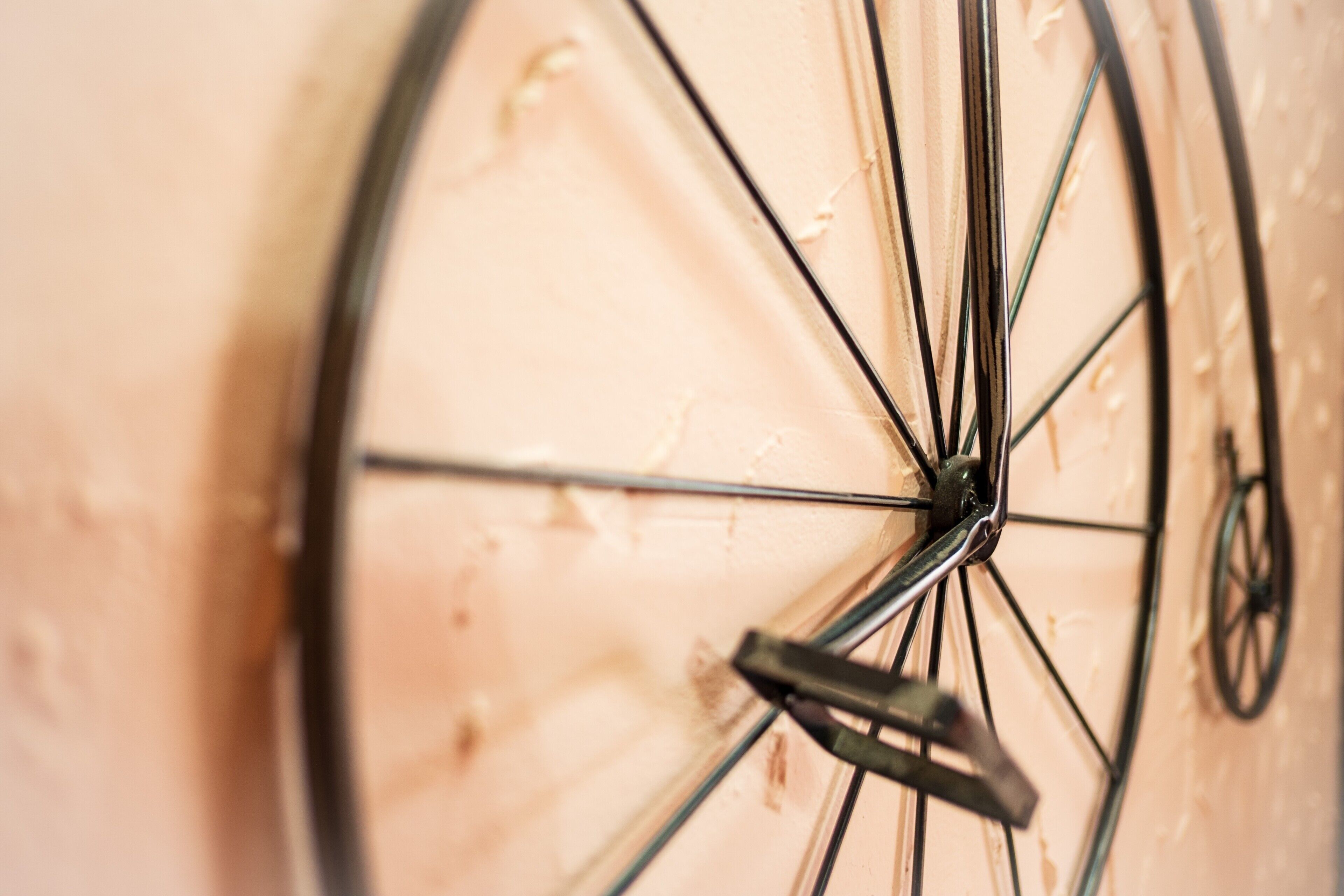 A close-up of a bicycle wheel with spokes and a hub.