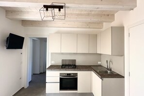 Fridge, oven, dishwasher, dining tables