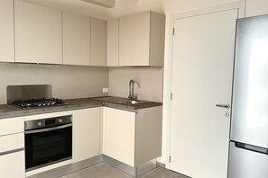 Fridge, oven, dishwasher, dining tables